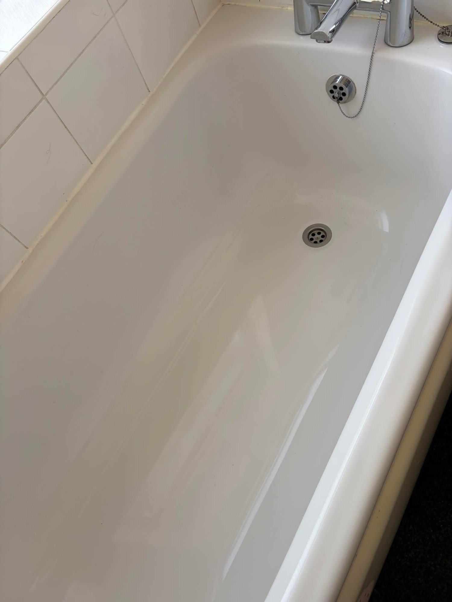Clean white bathtub after professional cleaning
