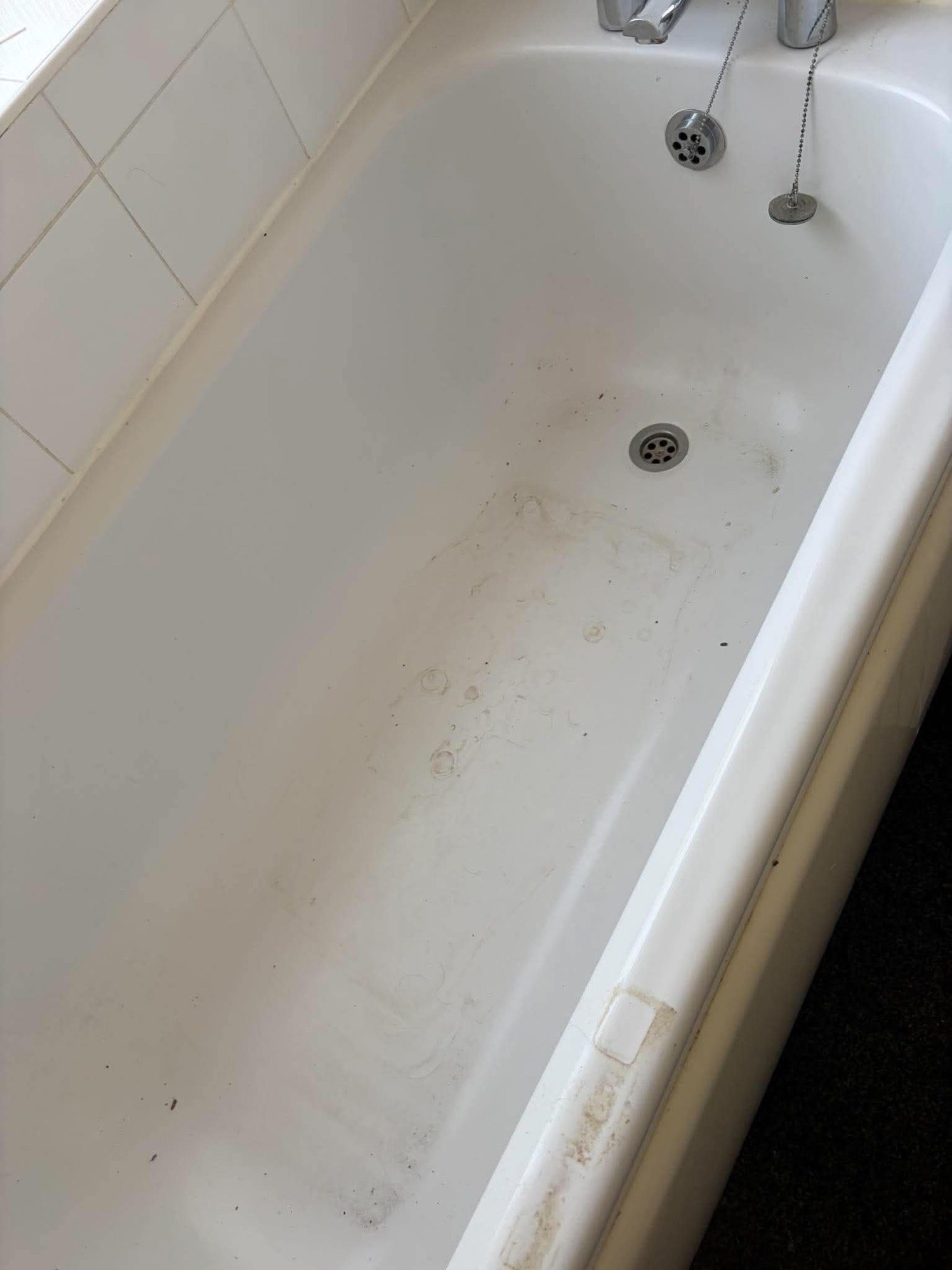 Dirty stained bathtub before cleaning