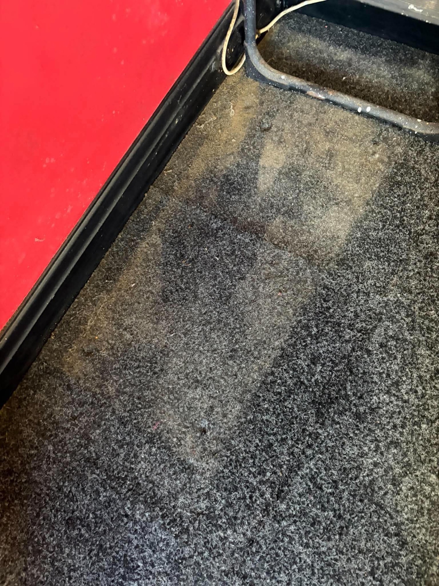 Dirty stained dark carpet before cleaning