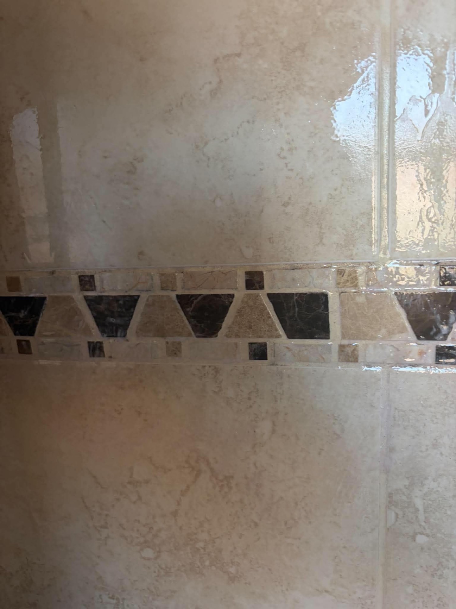 Shower tiles and grout after cleaning looking clean and bright